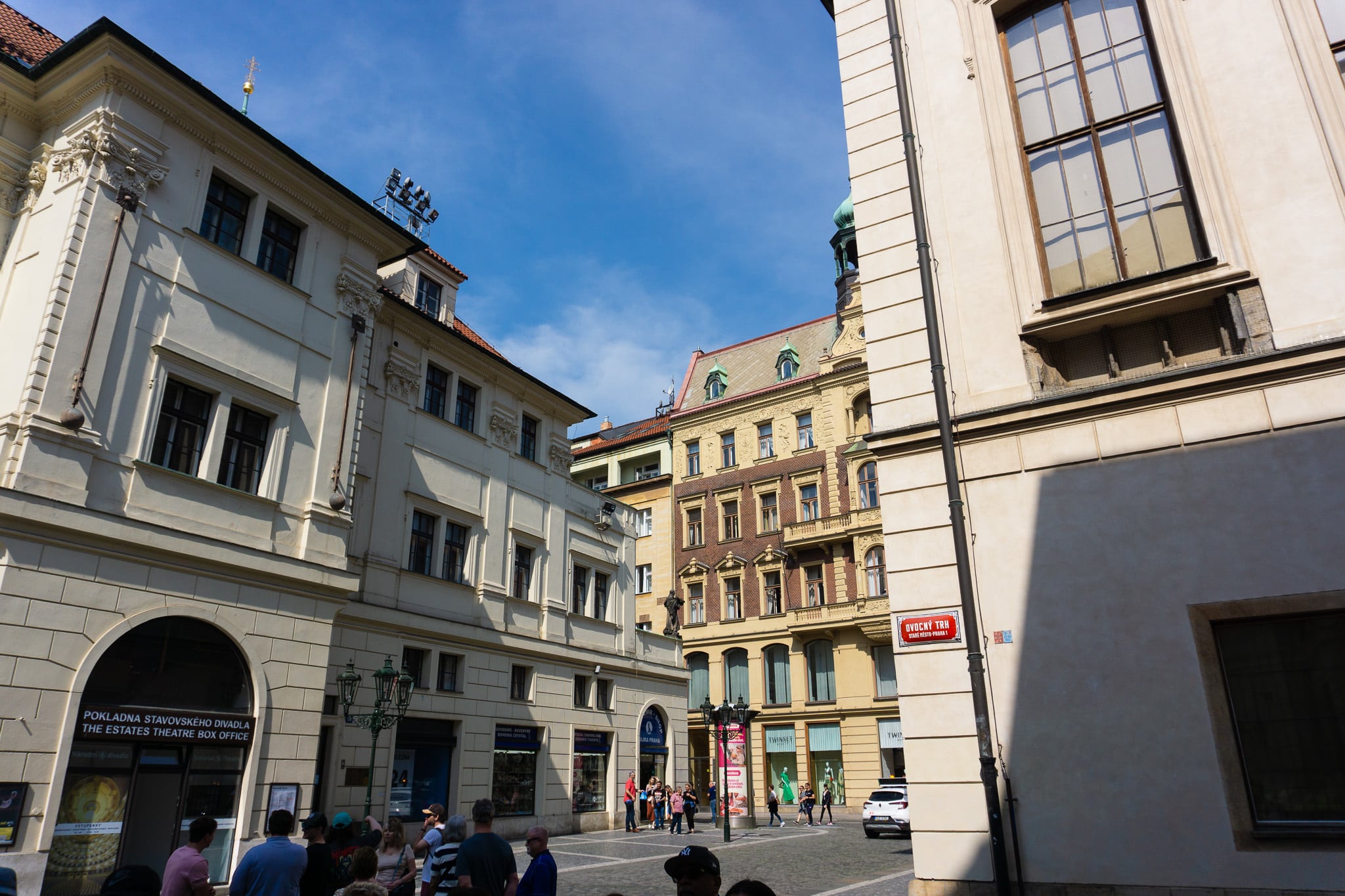 Street in Prague with sign for the Estates Theatre box office on Ovocny trh.