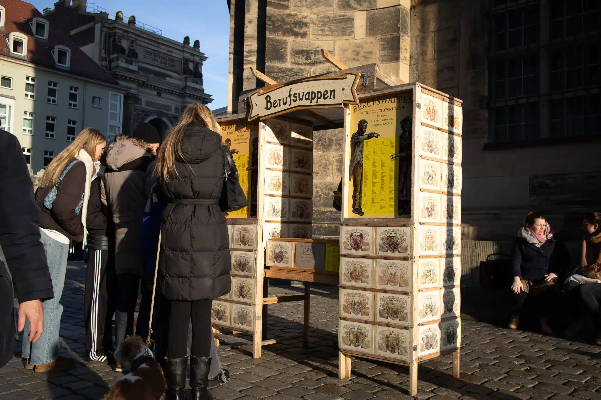 Berufswappen souvenir kiosk on a cobblestone square in Dresden