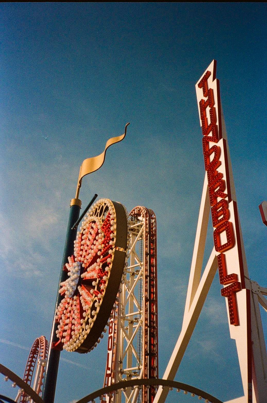 Low-angle view of the Thunderbolt sign and ride structure at Coney Island in Brooklyn.