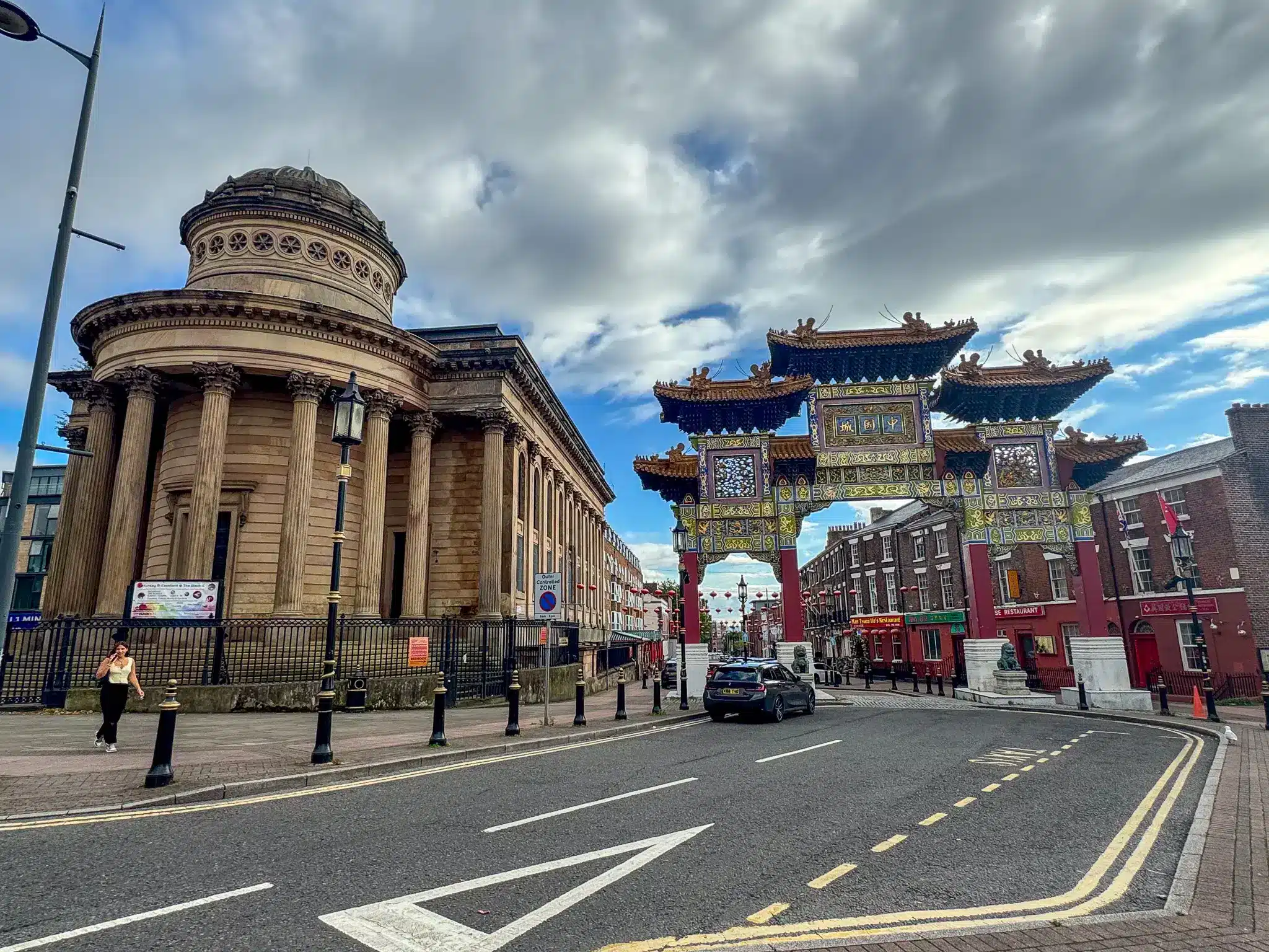 Liverpool Chinatown gateway on Nelson Street facing a large domed neoclassical building across a broad street.